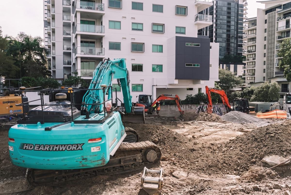HD Earthworx excavator on an inner-city apartment build